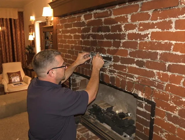 Warwick Chimney Sweep expert fixing a fireplace in Warwick, RI